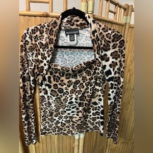 Frank Lyman design. Polyester/ elasthane. Size 4. Animal print